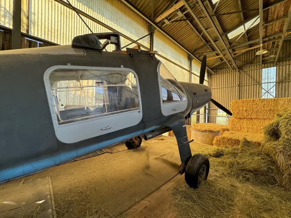 Side view of the HB-HAB aircraft inside a hangar.