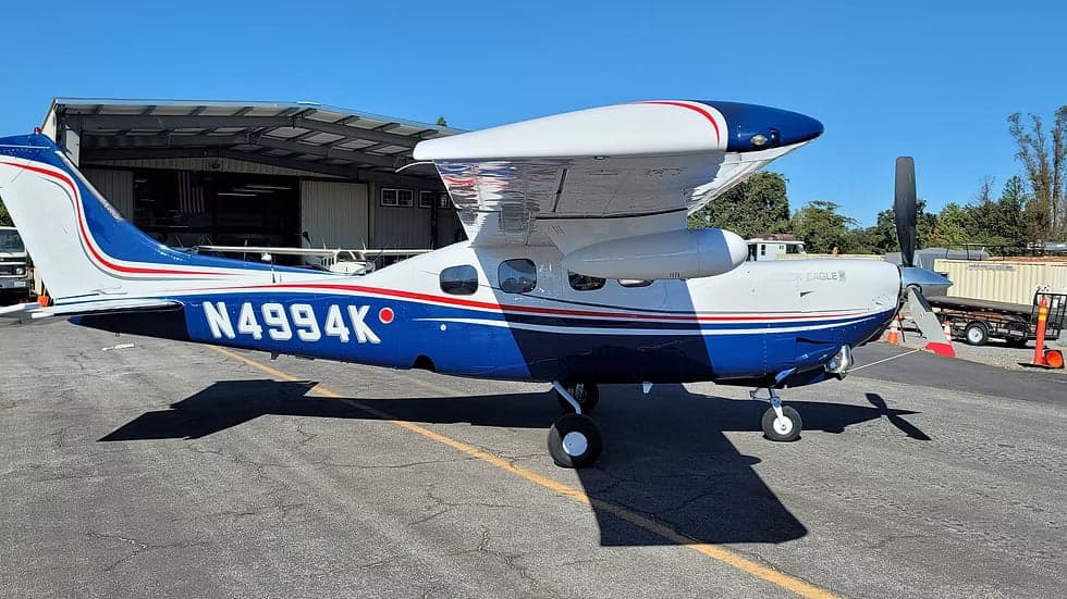 Another side view of the blue and white N4994K aircraft.