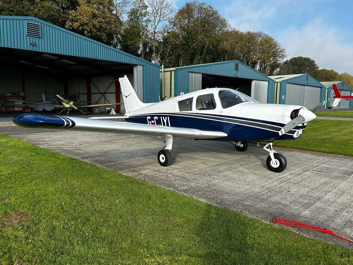 Piper PA-28-161 Warrior II aircraft parked on the tarmac.