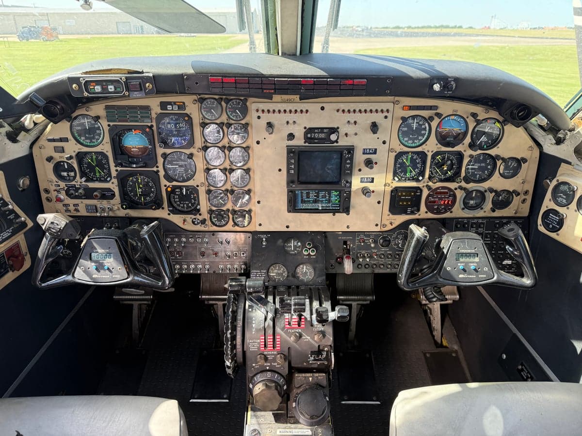 Detailed view of the aircraft's instrument panel and controls in the cockpit.