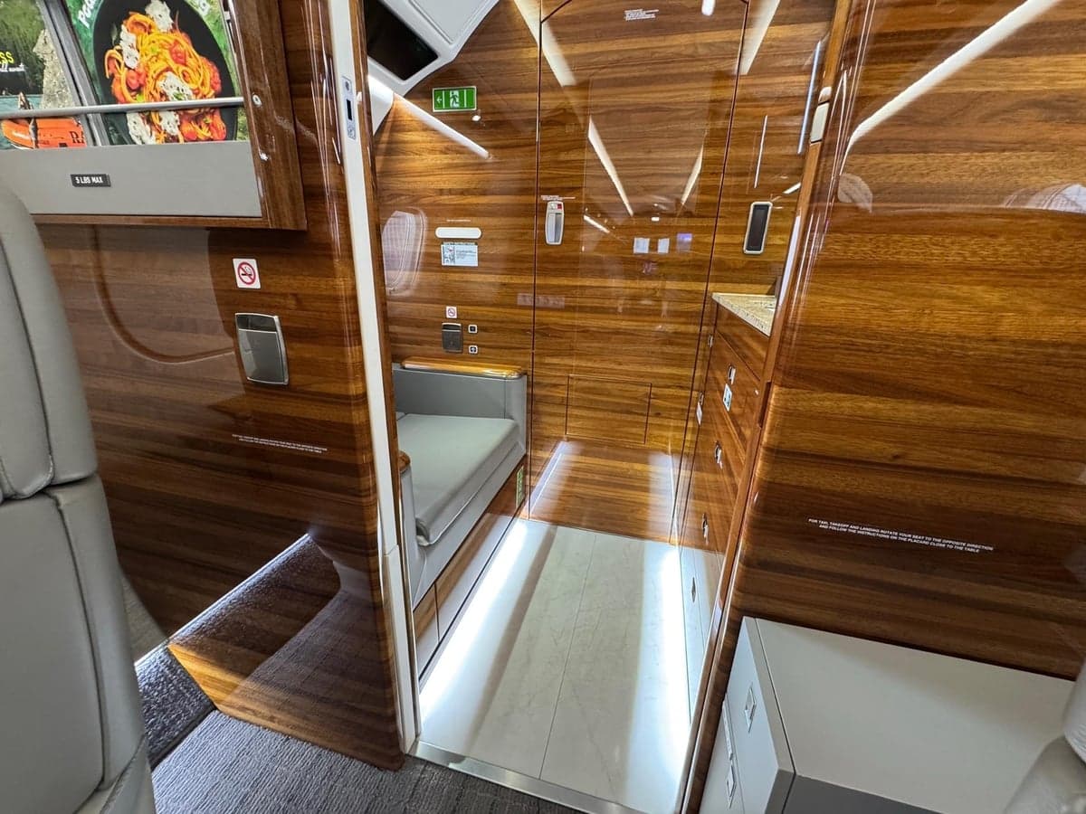 View of the aircraft's lavatory and cabin seats.
