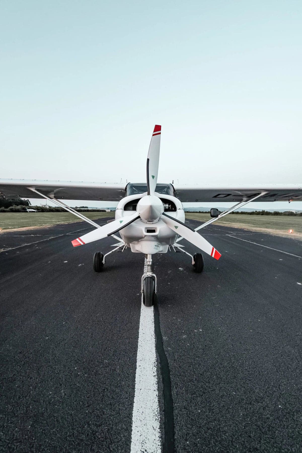 Front view of the D-EMBJ Maule STOL aircraft on the tarmac, showing the propeller.