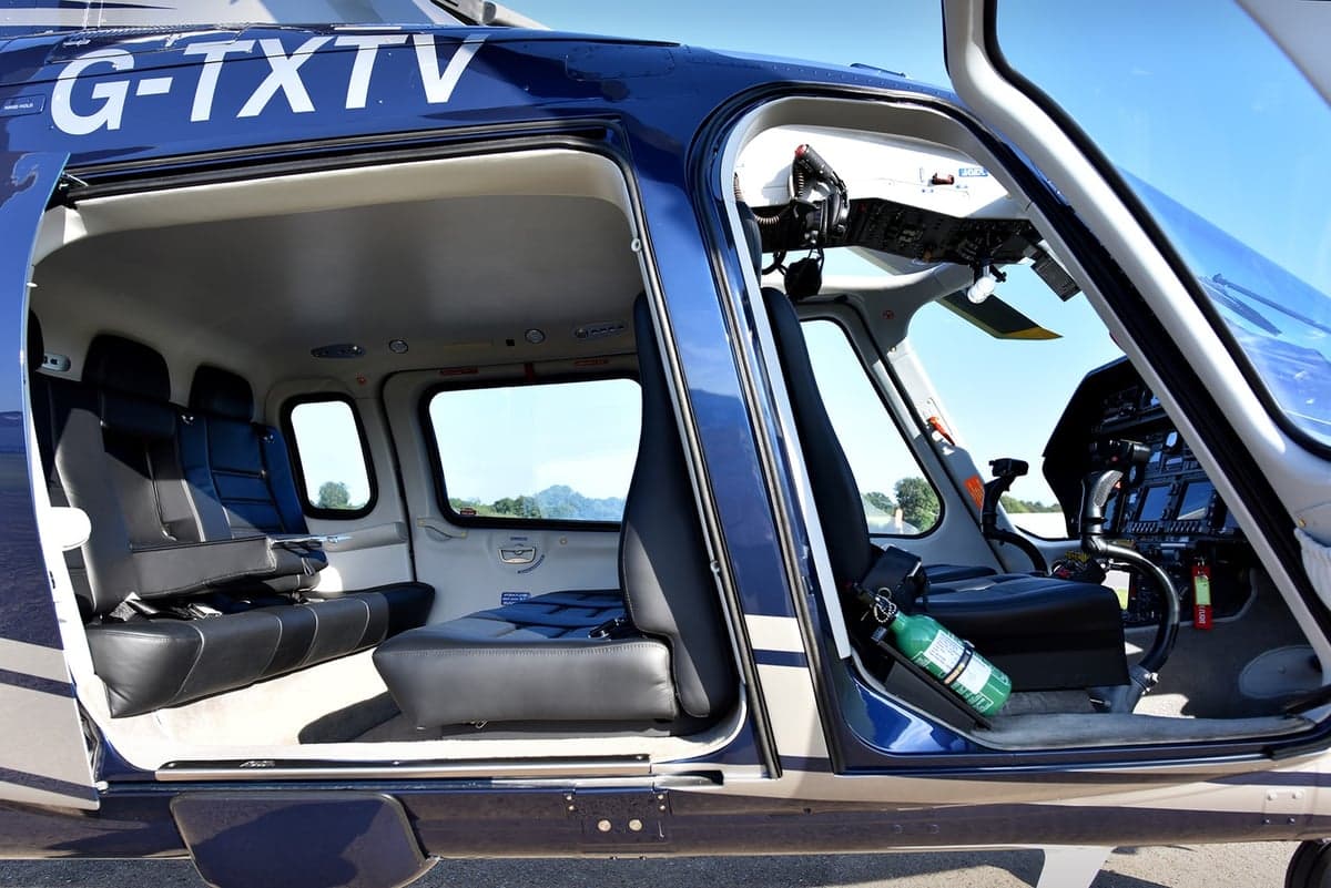 View of the helicopter's interior, showing the seating arrangement and cockpit.