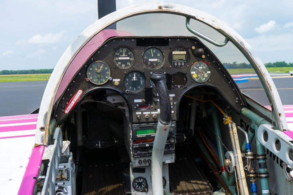 View of the instrument panel and controls inside the cockpit of an aircraft.
