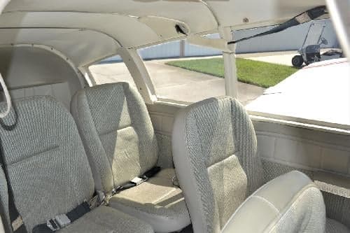 Interior view of the aircraft cabin showing the seating arrangement.