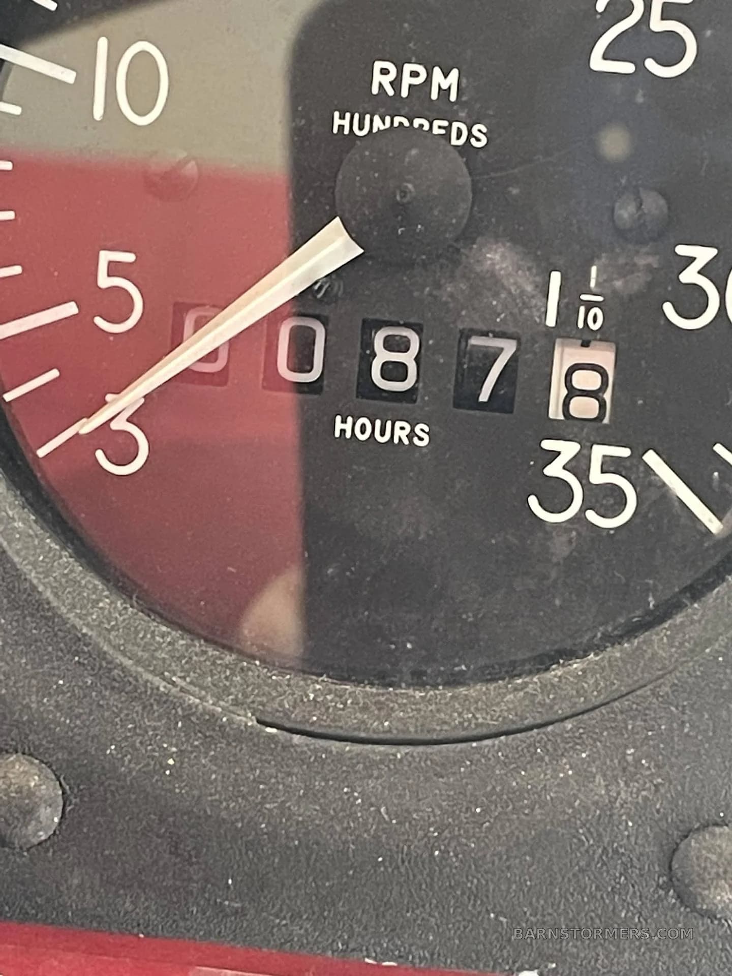 A close-up of an aircraft's hour meter, displaying 0878.8 hours.