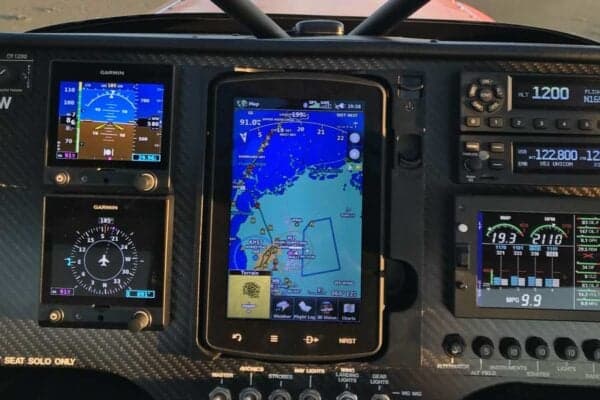 Close-up of the aircraft's instrument panel with Garmin displays.