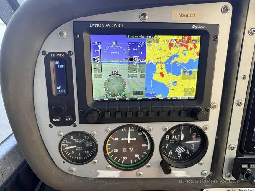 A close-up of the Dynon Avionics SkyView display and analog gauges in the cockpit of a light sport aircraft.