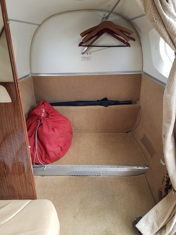 A view of the interior cabin of the aircraft, showing the storage area.