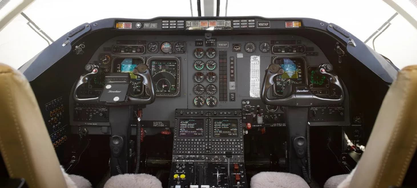 Detailed view of the Hawker 400XP cockpit instrument panel.