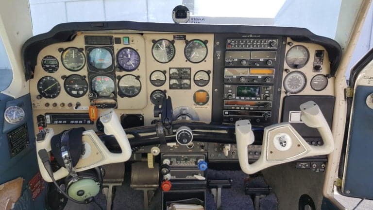 The aircraft's instrument panel features a variety of gauges and controls.