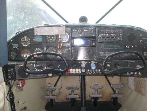 View of the aircraft's instrument panel and control yokes.