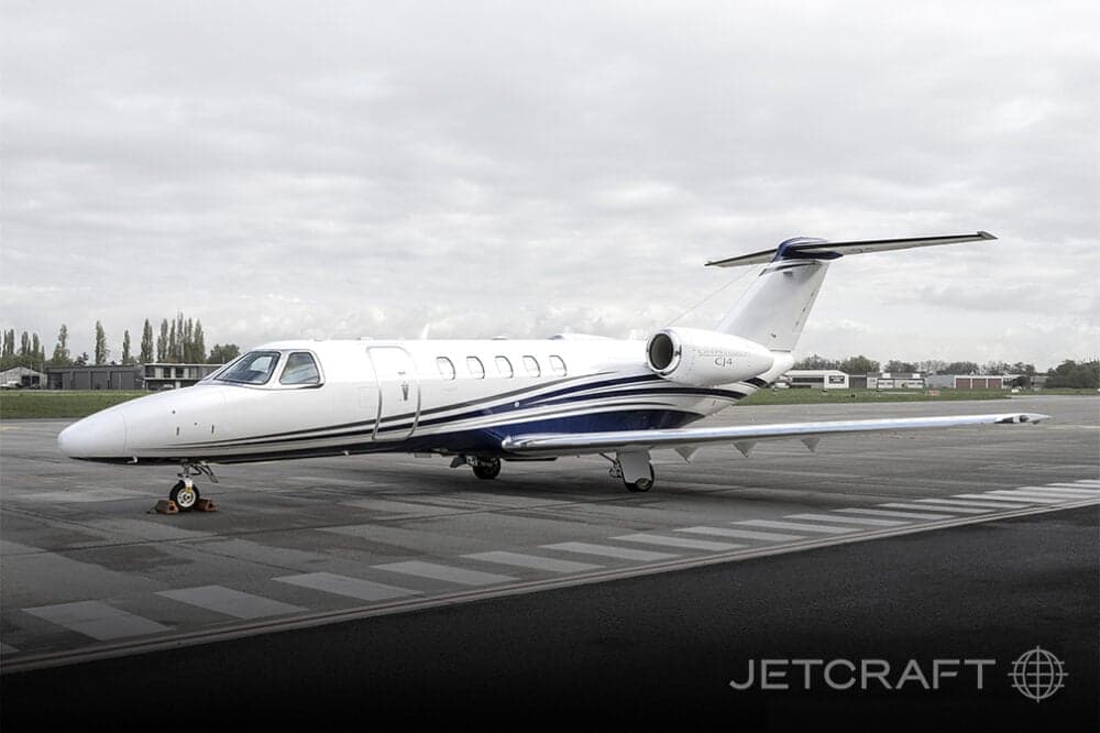 A CJ4 aircraft parked on the tarmac.