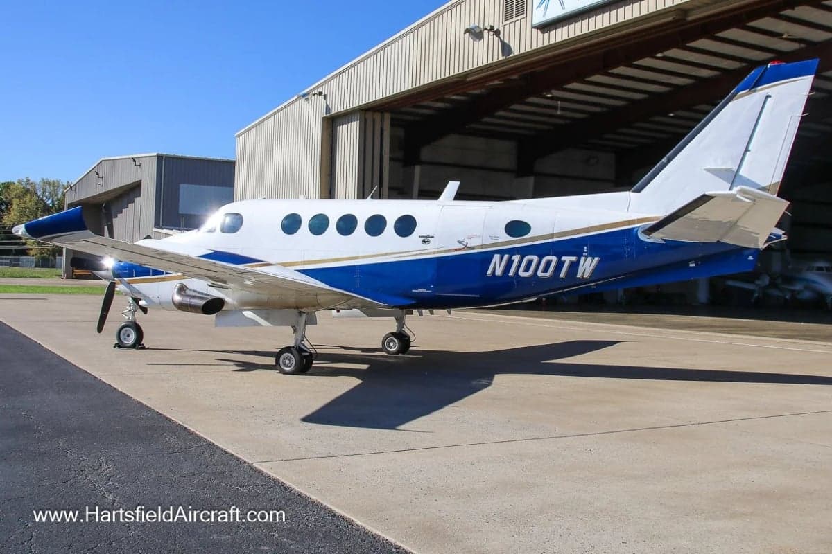 King Air aircraft N100TW parked on the tarmac.