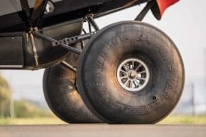 Close-up of the aircraft's large tundra tires.