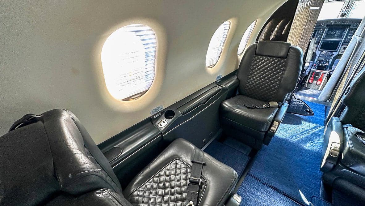 Interior view of the Pilatus PC-12 cabin with leather seats.