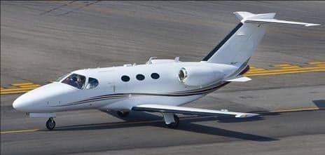 A Citation Mustang jet on the tarmac.