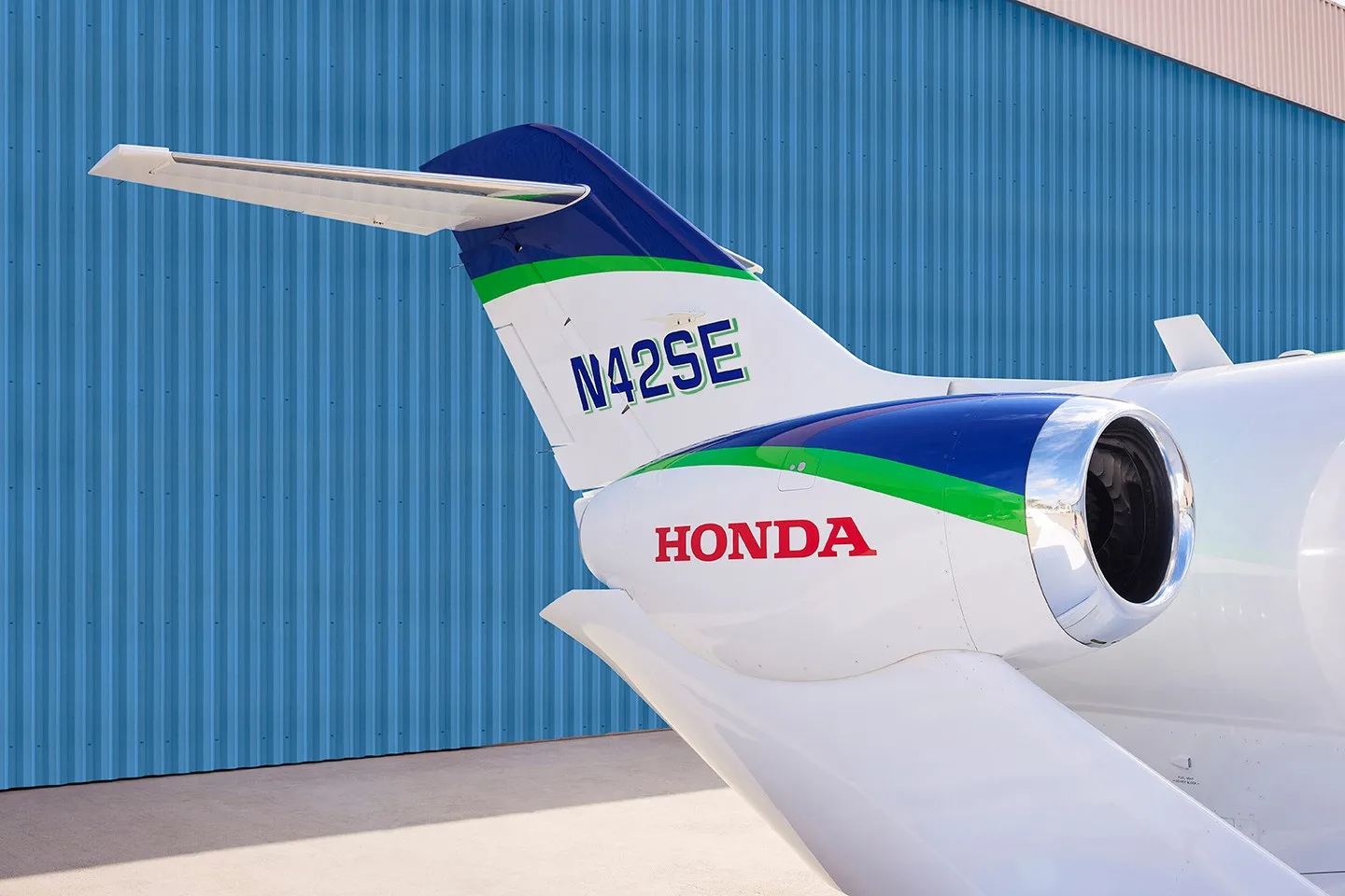 Close-up of the tail section of a HondaJet Elite, showing the registration N42SE and "HONDA" logo.