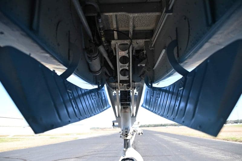 View of the underside of a Beechcraft King Air, showing the landing gear bay.