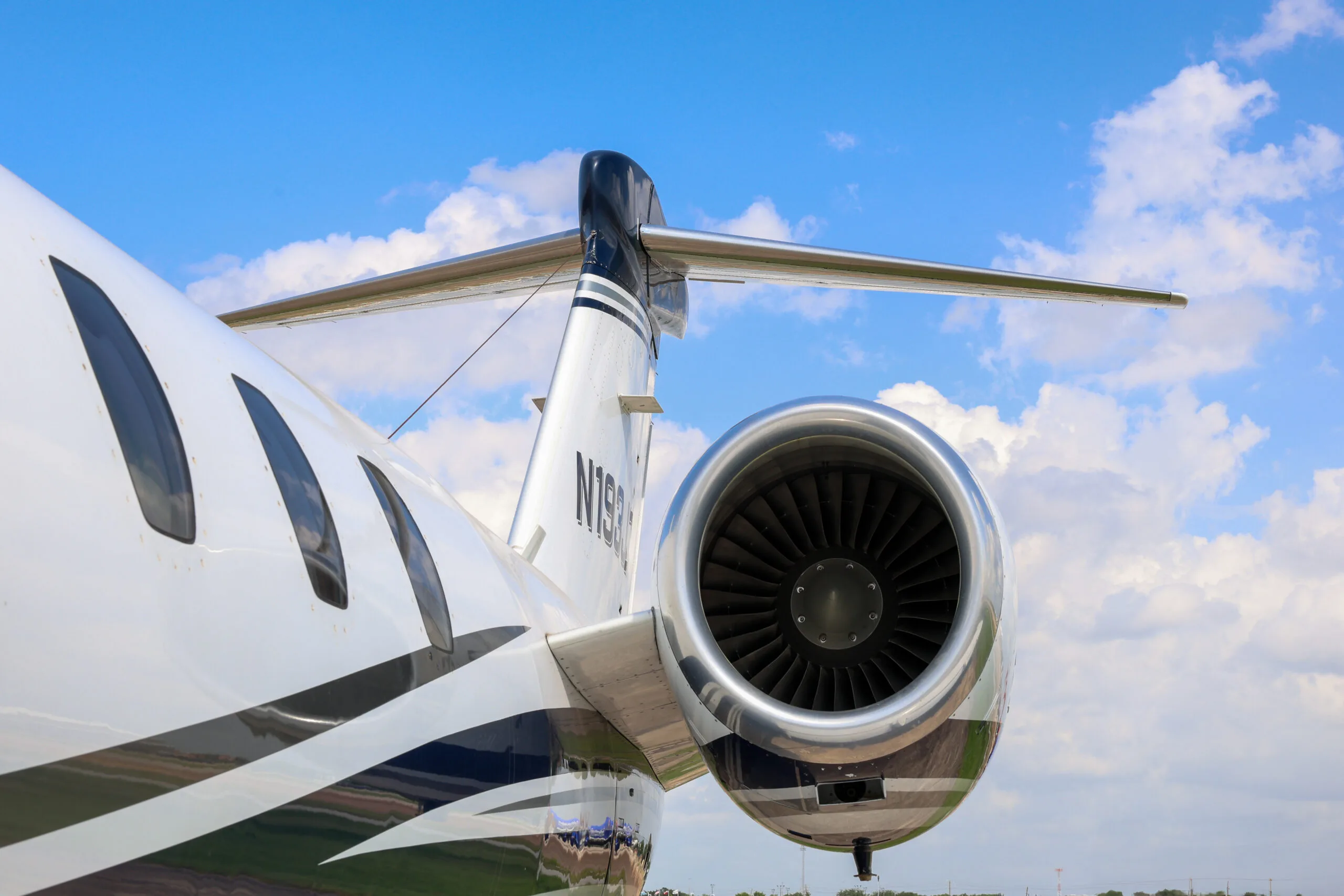 Close up of the tail and engine of the Cessna Citation CJ3 with registration N193JC.
