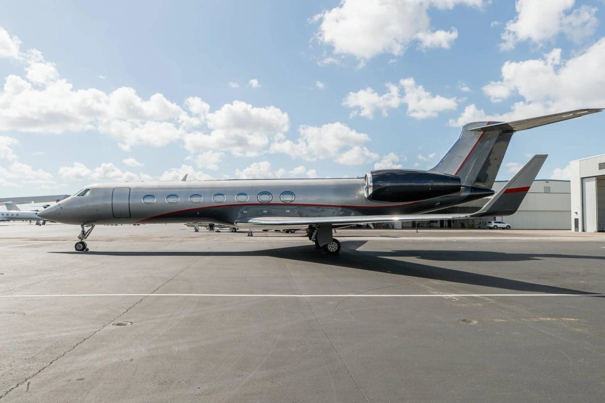 A Gulfstream G550 aircraft is parked on the tarmac.