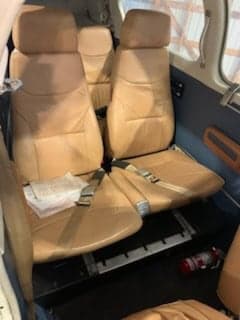 Interior view of the aircraft cabin showing the seats.