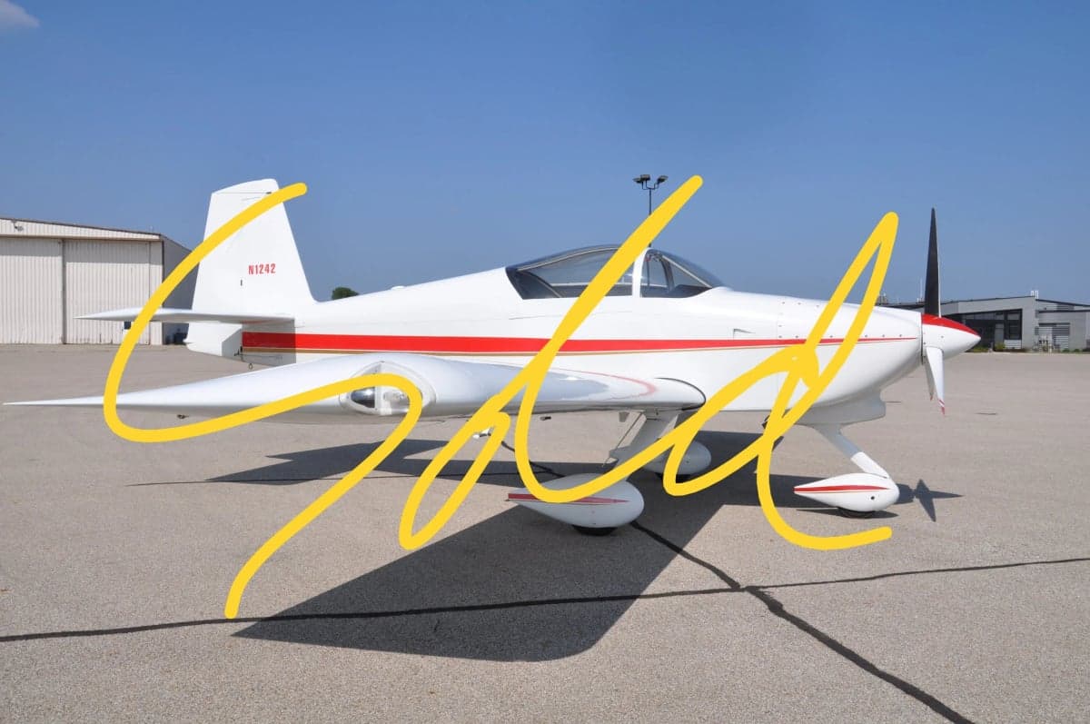 Side view of a white and red aircraft with yellow SOLD text overlaid.