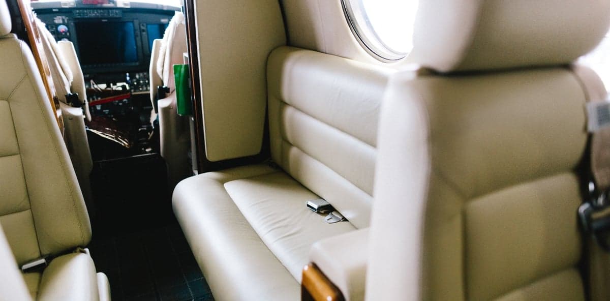 Interior view of the aircraft cabin showing the seats and cockpit.