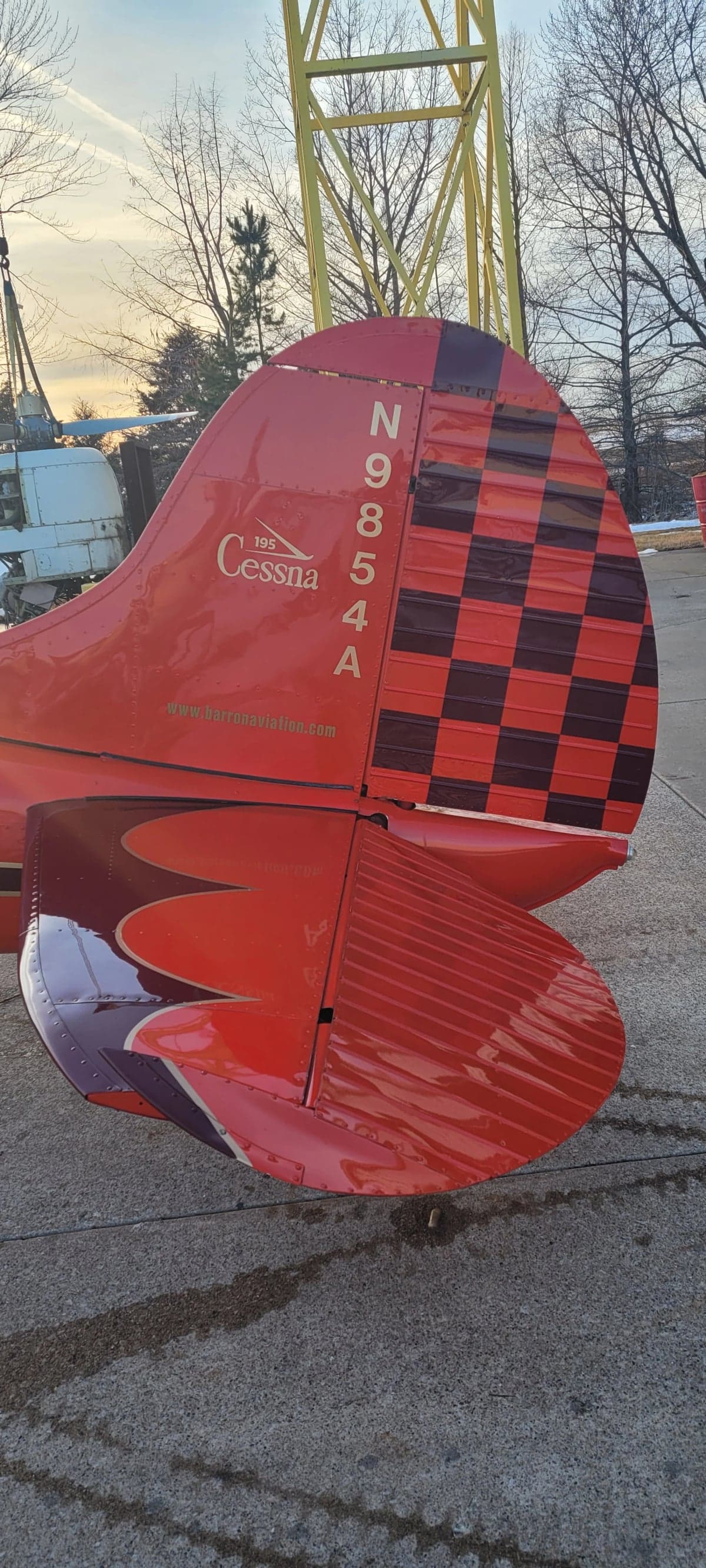 Close-up of the tail of the Cessna 195, showing the registration N9854A.