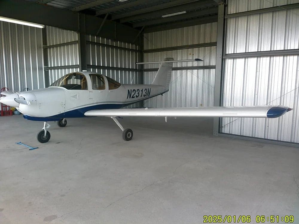 Aircraft N2313N parked inside a hangar.