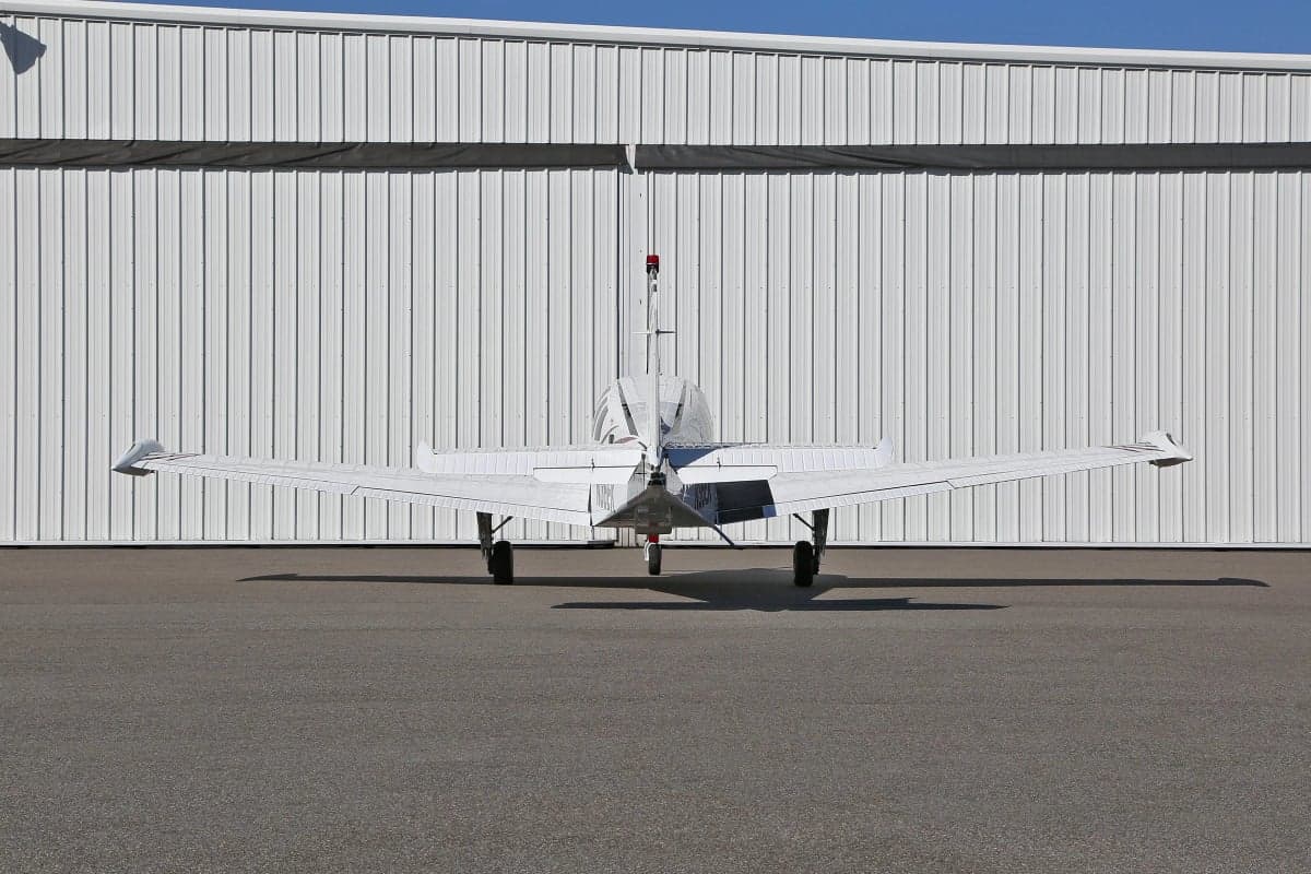 Rear view of a Beechcraft Bonanza on the tarmac.