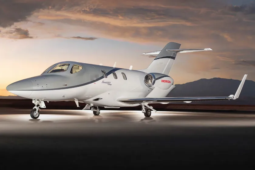 Stock photo of a HondaJet with silver and white paint scheme.