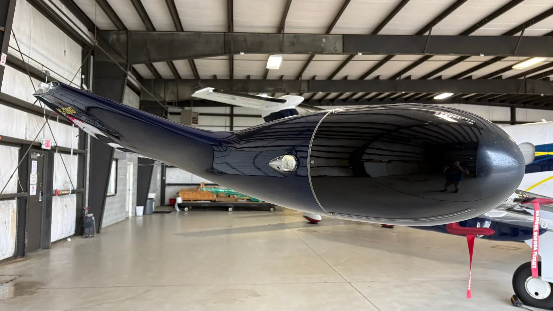 Pilatus PC-12 aircraft N757BT tail section inside a hangar.