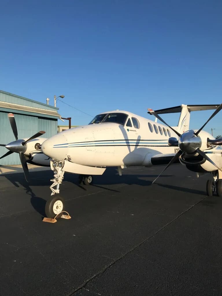 A King Air aircraft parked on the tarmac.