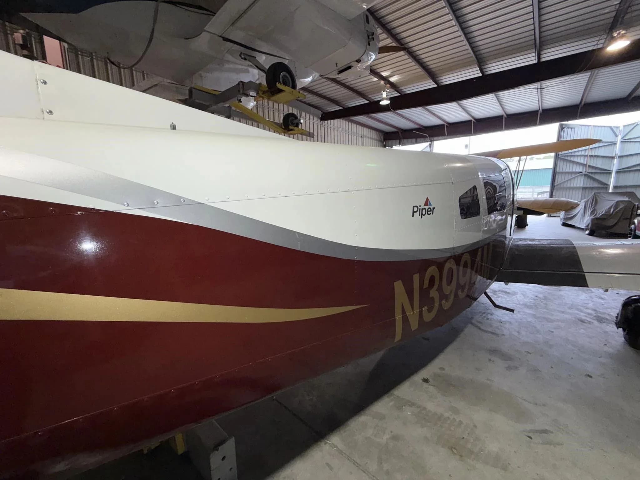 A close-up of the rear fuselage of the Piper Lance II aircraft N3994M, displaying the "Piper" logo and registration.