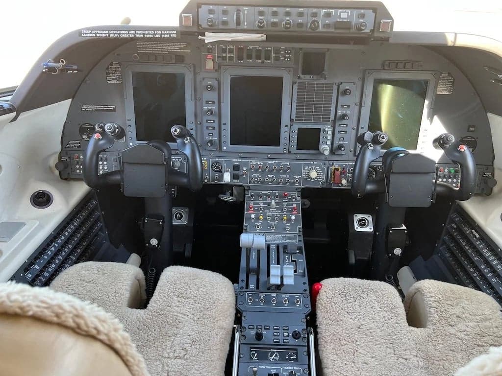 The cockpit of the Piaggio Avanti EVO features a modern instrument panel and comfortable seating.