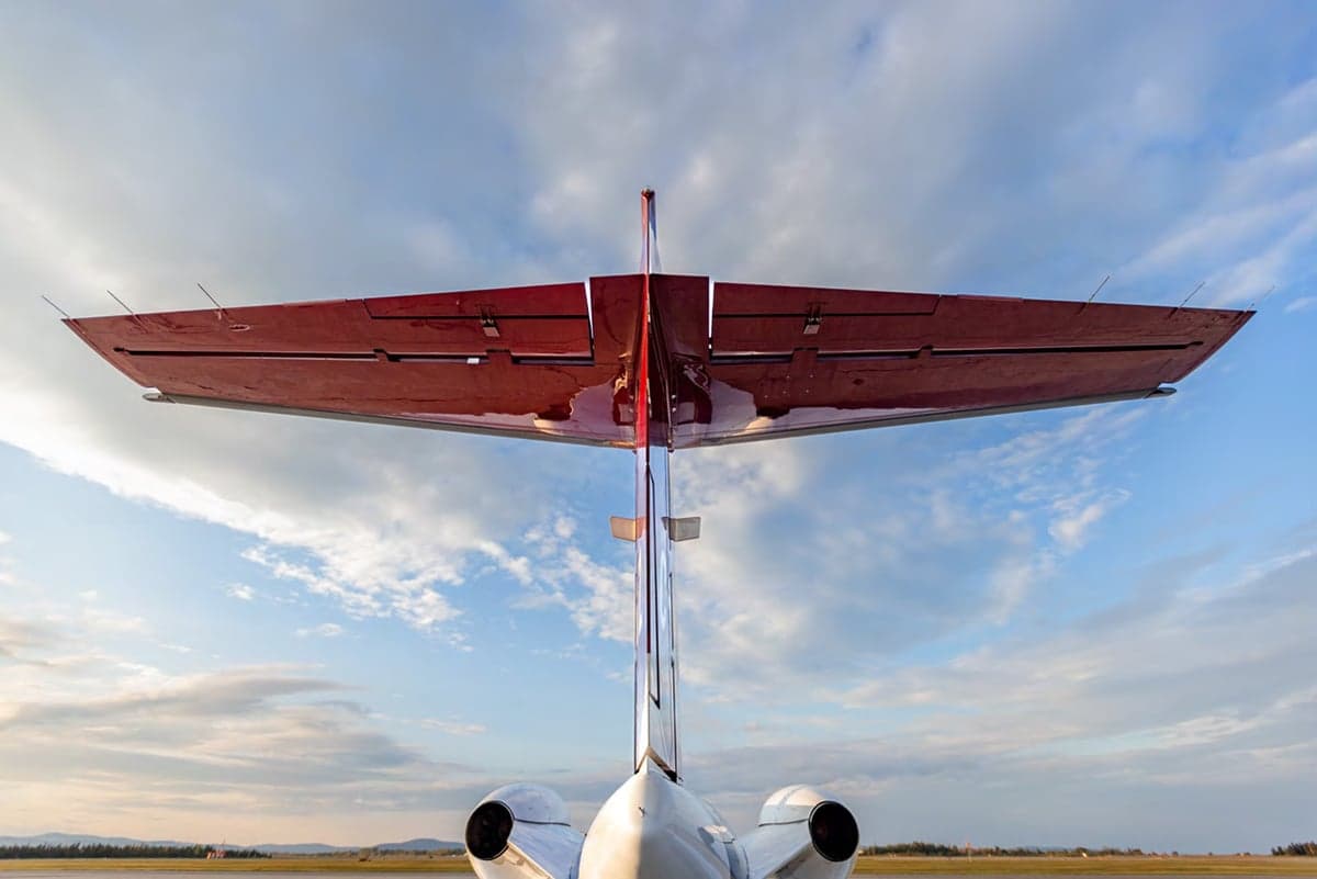 A Cessna CJ1+ aircraft with registration C-GWGZ on the tarmac at sunset.