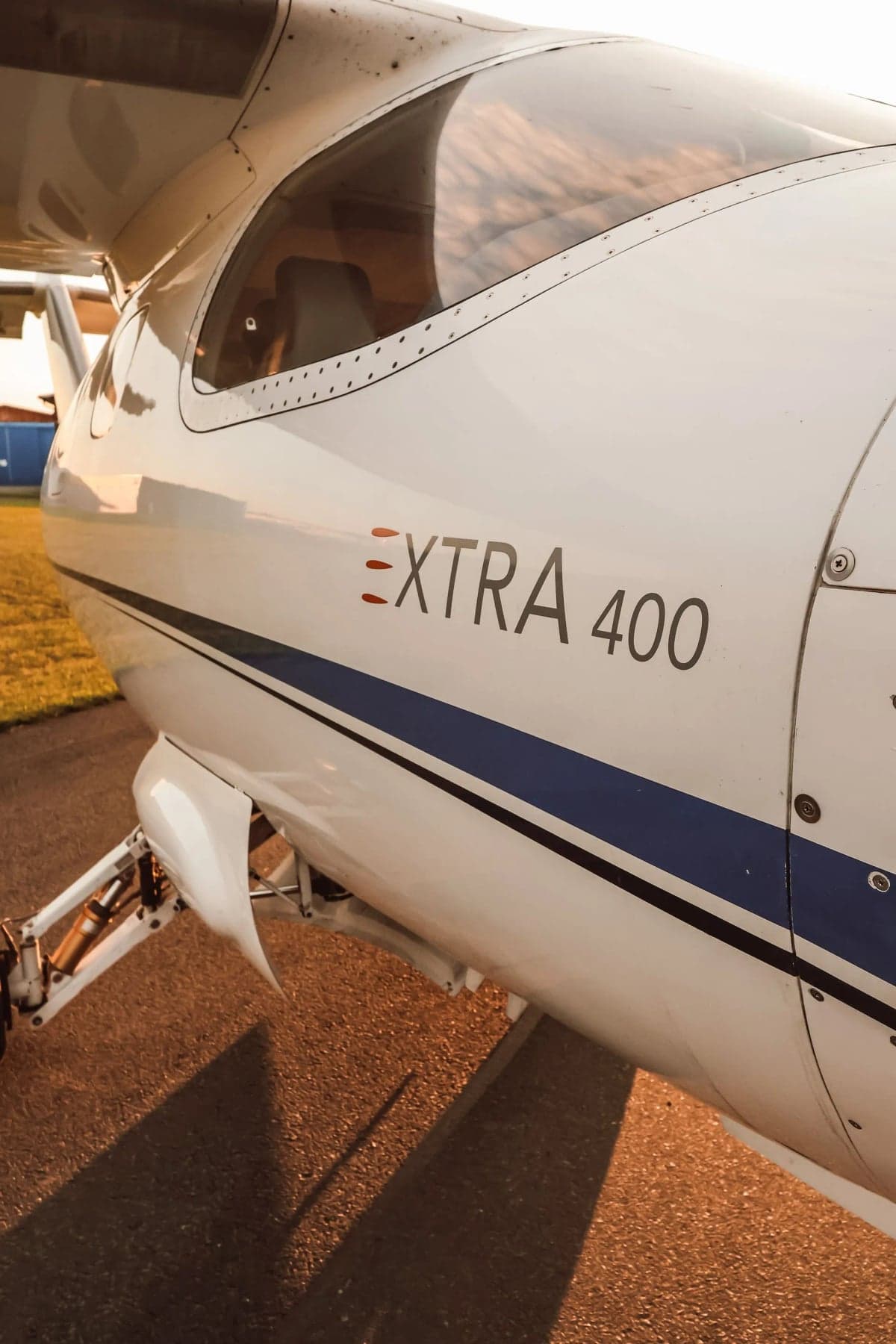 Close up of the Extra 400 logo on the side of the aircraft.