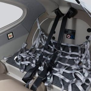 View of the Diamond DA40 cabin featuring the cargo net and interior details.