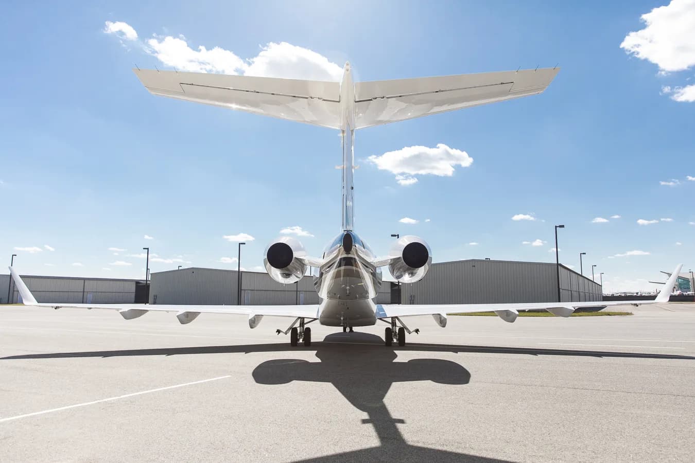 Rear view of the Challenger 300 aircraft on the tarmac.