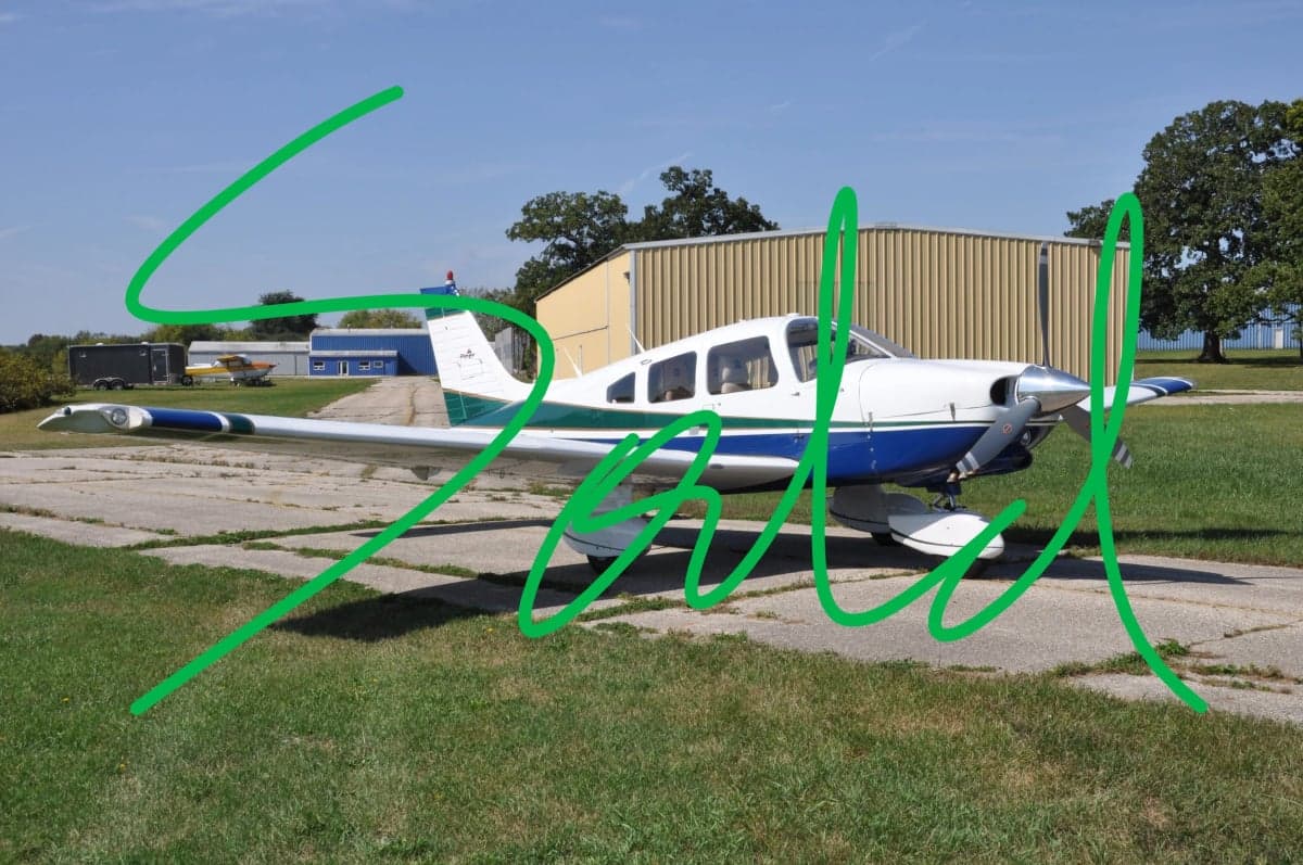 A Piper Dakota aircraft parked on a runway with a SOLD overlay.