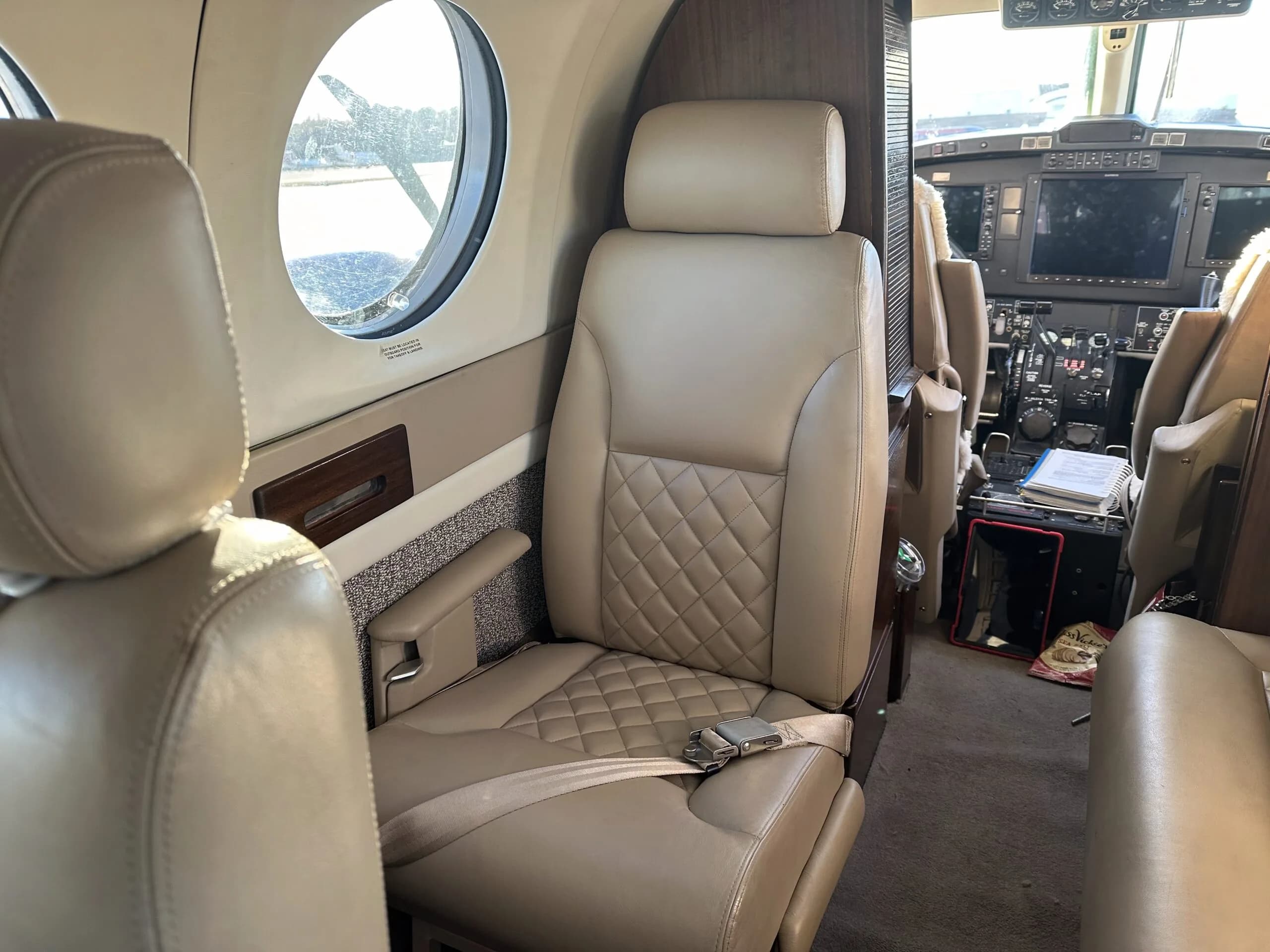 Interior of a Beechcraft King Air 360ER with tan leather seats.