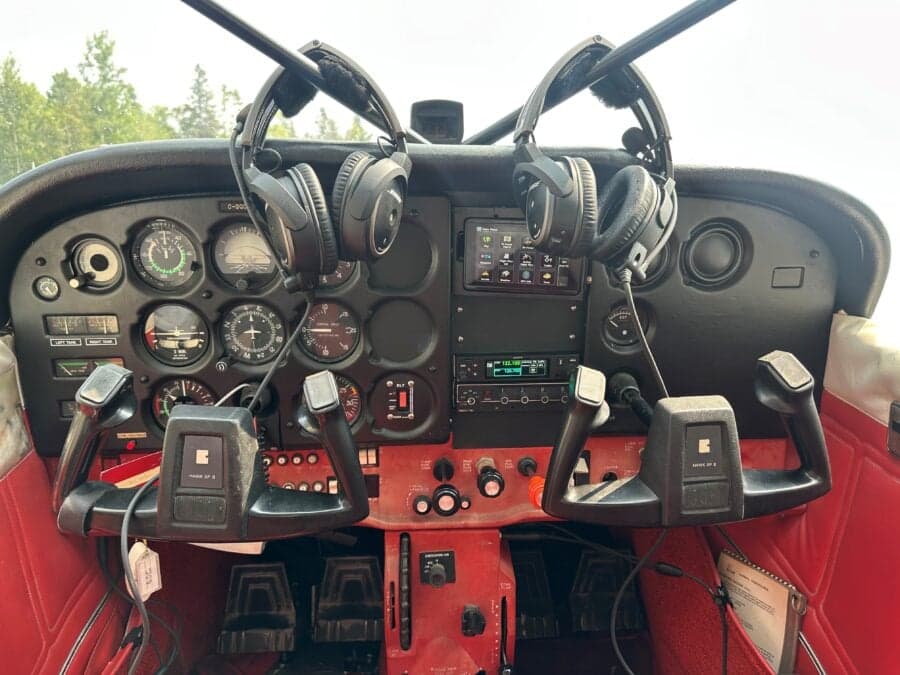 The cockpit of the Cessna floatplane features a full instrument panel and control yokes.