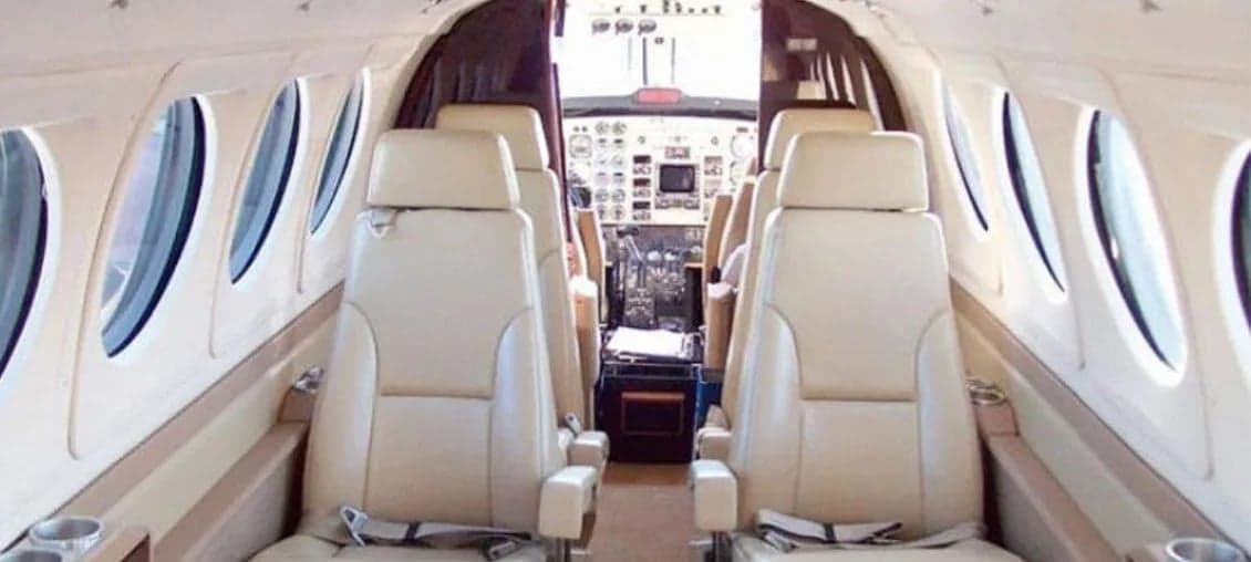 Aircraft cabin with leather seats.