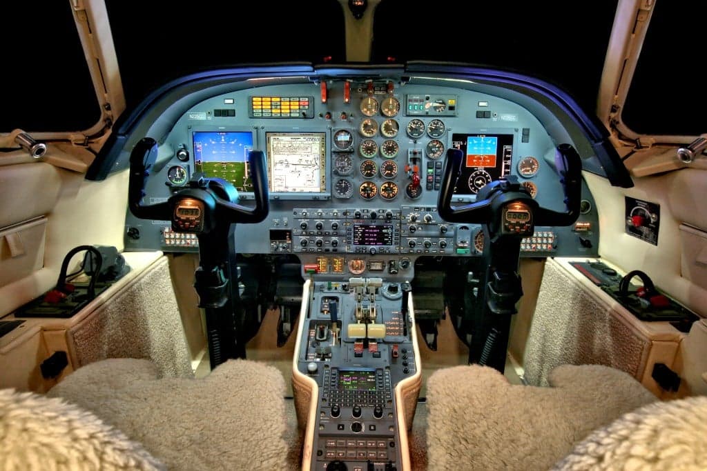 View of the Hawker 4000 cockpit featuring the instrument panel and pilot seats.