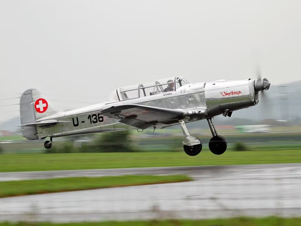 Potez 58 aircraft in flight with Swiss markings and HB-RAR tail number.
