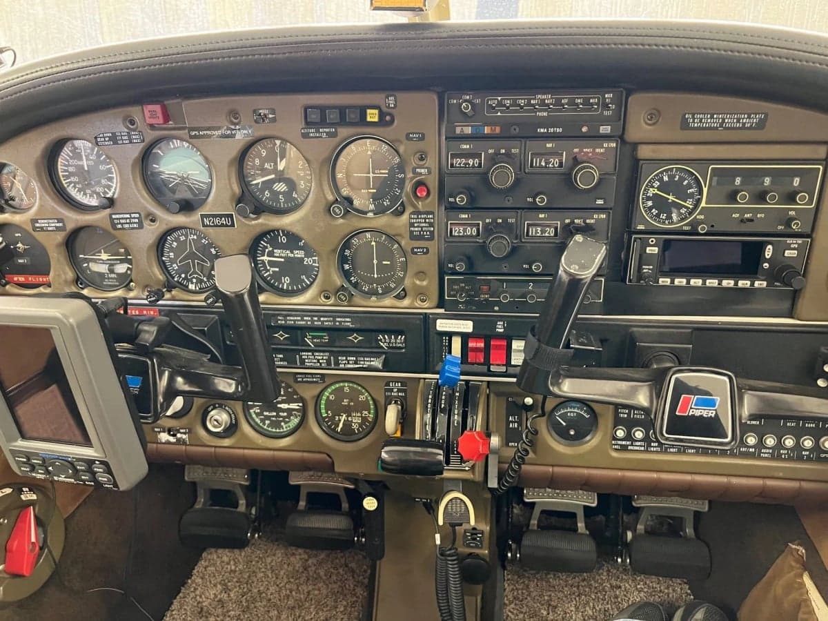 Interior view of the aircraft cabin showing the seats and side panels.