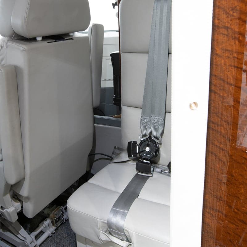 Close-up of the aircraft seat and seatbelt.