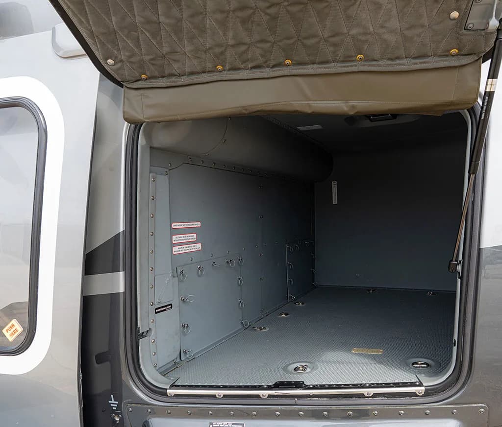 Close-up view of the empty cargo compartment inside the AgustaWestland AW169 helicopter.