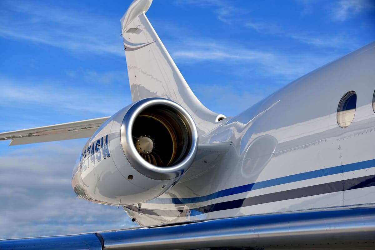 Close up of the tail and engine of a Falcon aircraft.